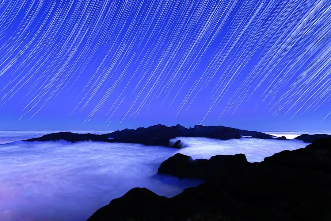 A long exposure of a star trail over the ocean